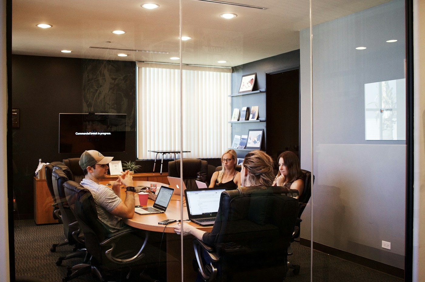 Colleagues discussing a project around a conference table